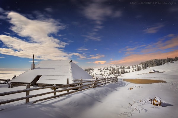 First abundant snowfall of the winter season 2015-16 has come to Velika planina. The moonlight spreads over the vast pastures and wooden cottages. Through the openings in the clouds bright stars shine in this early evening. There is this peace up there, that you can only "hear" when the snow covers the landscape...