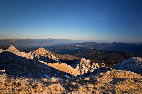 View from mount Tosc towards Pokljuka plateau.In the Distance there can be seen the highest peaks of Kamniško Savinjske Alpe. 
